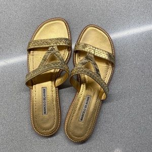 Manolo Blahnik flat gold sandals.